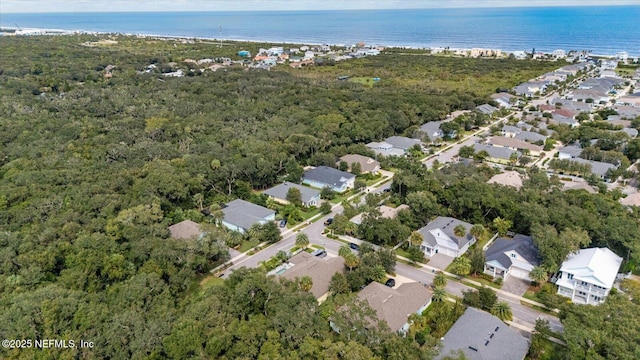 drone / aerial view with a residential view and a water view