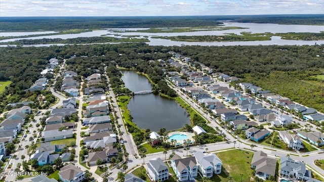 aerial view featuring a water view, a forest view, and a residential view