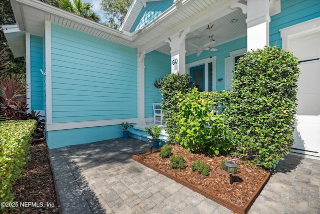 view of side of property featuring ceiling fan