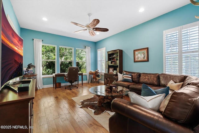 living room with a ceiling fan, recessed lighting, baseboards, and hardwood / wood-style flooring