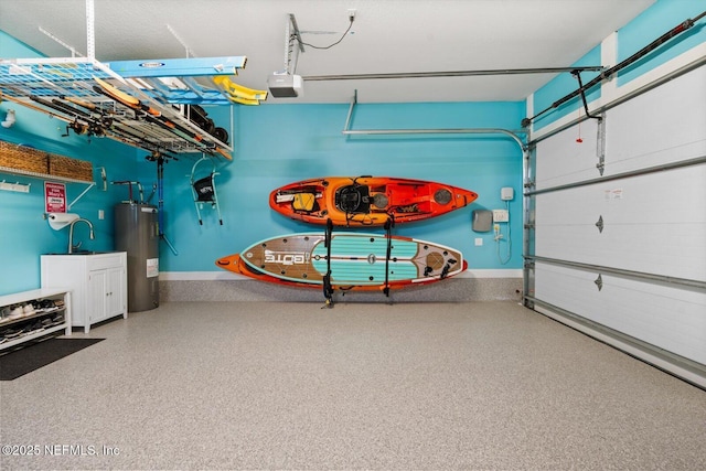 garage with a garage door opener and electric water heater