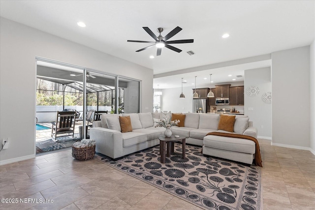 living room featuring recessed lighting, visible vents, a sunroom, ceiling fan, and baseboards