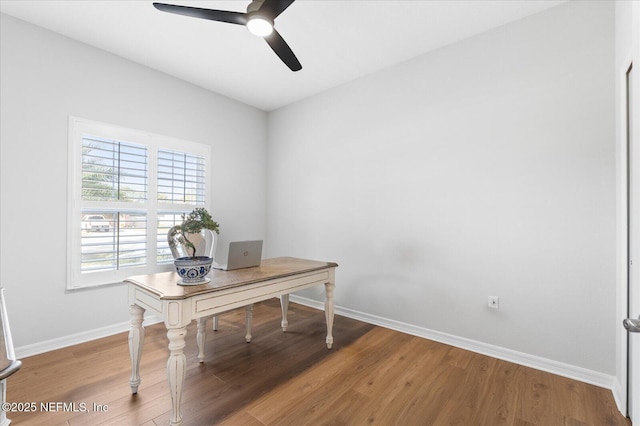 home office with ceiling fan, wood finished floors, and baseboards