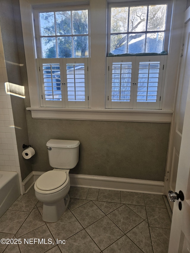 full bathroom featuring toilet, french doors, tile patterned flooring, a shower, and a bathtub