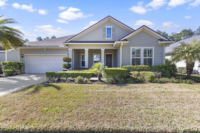 view of front facade featuring an attached garage, concrete driveway, and a front lawn