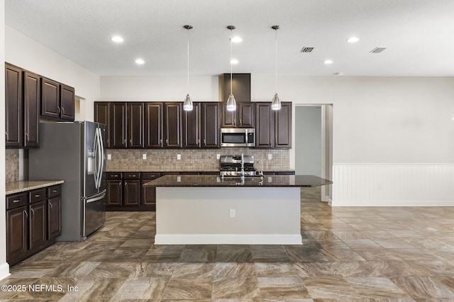 kitchen with dark brown cabinetry, visible vents, and appliances with stainless steel finishes