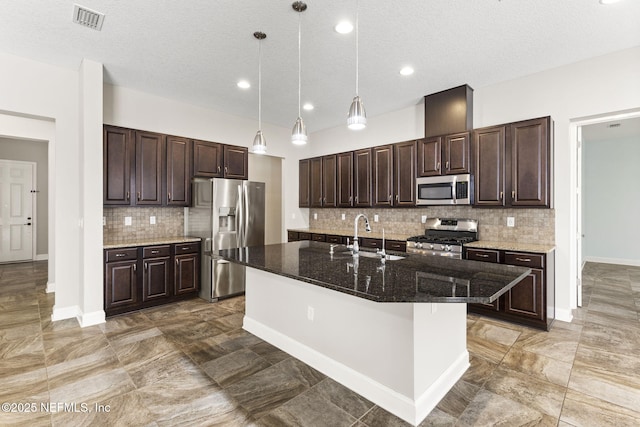 kitchen with dark brown cabinets, visible vents, and stainless steel appliances