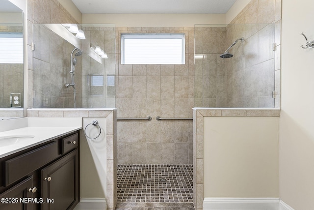 full bath with walk in shower and vanity