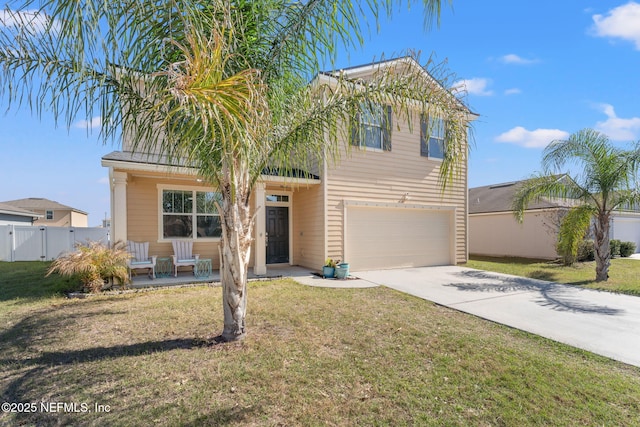 view of front of home featuring a garage, concrete driveway, a front yard, and fence