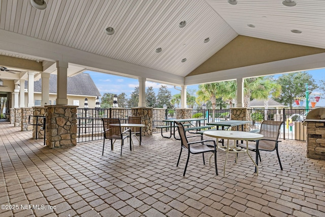 view of patio / terrace with an outdoor kitchen and outdoor dining space