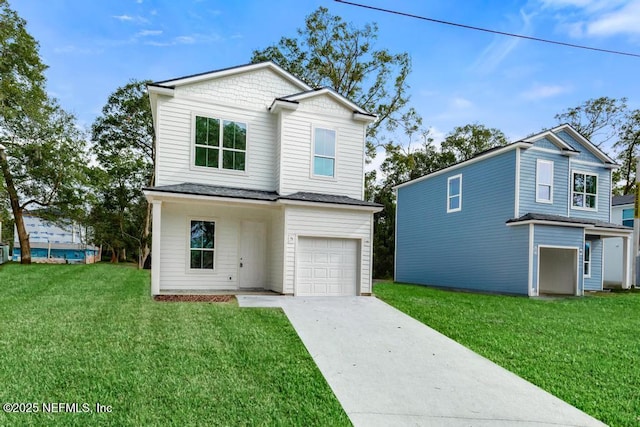 traditional-style house featuring a garage, concrete driveway, and a front yard