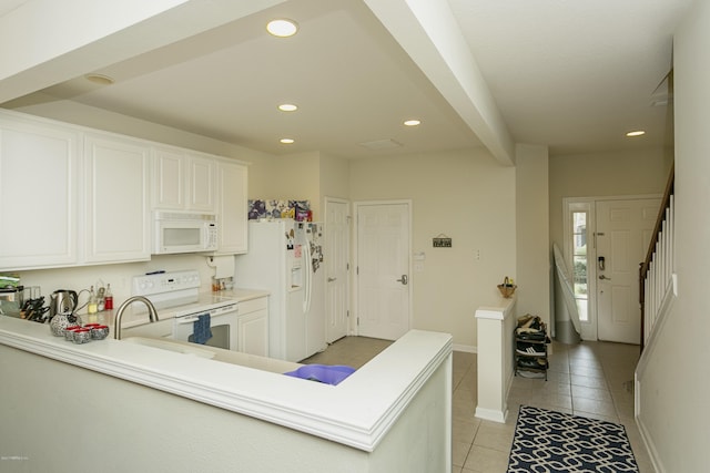 kitchen featuring baseboards, light countertops, light tile patterned floors, recessed lighting, and white appliances