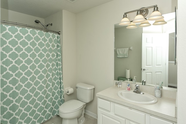 bathroom featuring tile patterned floors, a shower with curtain, toilet, and vanity