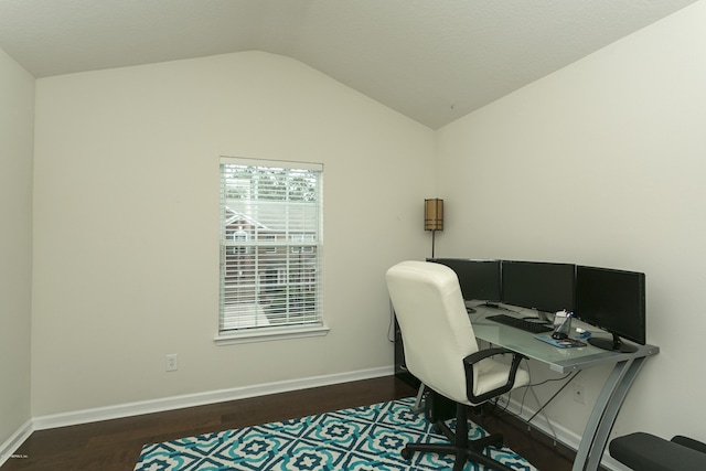 office area with baseboards, wood finished floors, and vaulted ceiling