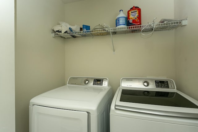 clothes washing area featuring laundry area and separate washer and dryer