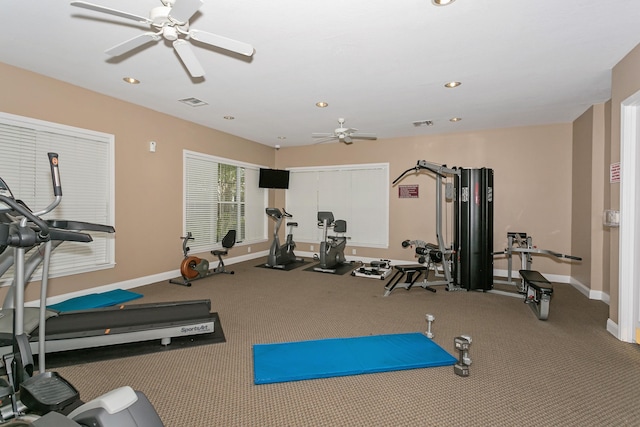 gym featuring recessed lighting, a ceiling fan, and baseboards