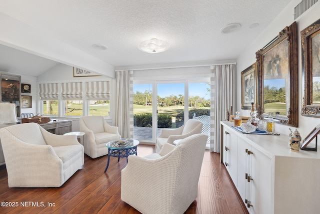 22 Walkers Ridge Dr, Ponte Vedra Beach, FL 32082 - living room with dark wood-style floors, plenty of natural light, lofted ceiling, and a textured ceiling