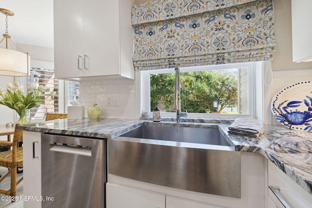 22 Walkers Ridge Dr, Ponte Vedra Beach, FL 32082 - kitchen featuring dishwasher, white cabinetry, decorative backsplash, and light stone counters