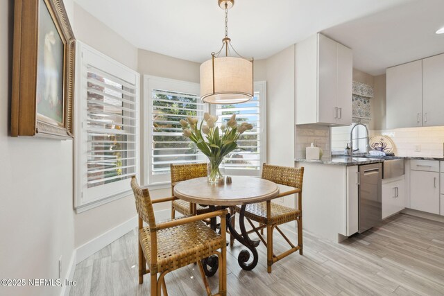 22 Walkers Ridge Dr, Ponte Vedra Beach, FL 32082 - dining space with light wood finished floors and baseboards