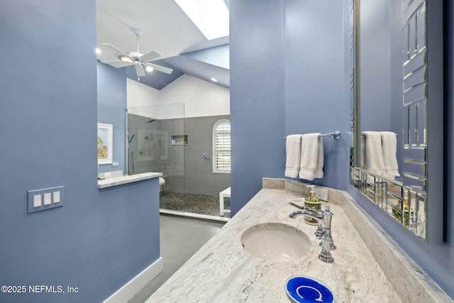 22 Walkers Ridge Dr, Ponte Vedra Beach, FL 32082 - bathroom featuring ceiling fan, a walk in shower, a skylight, double vanity, and vaulted ceiling