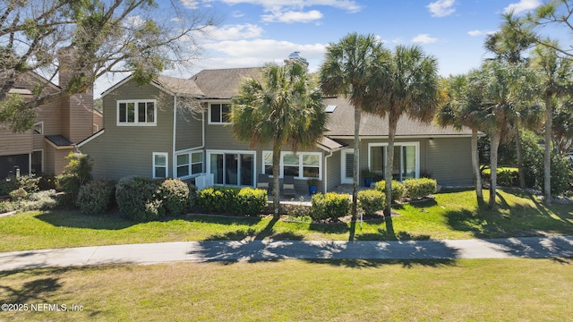 22 Walkers Ridge Dr, Ponte Vedra Beach, FL 32082 - back of house featuring a chimney and a yard