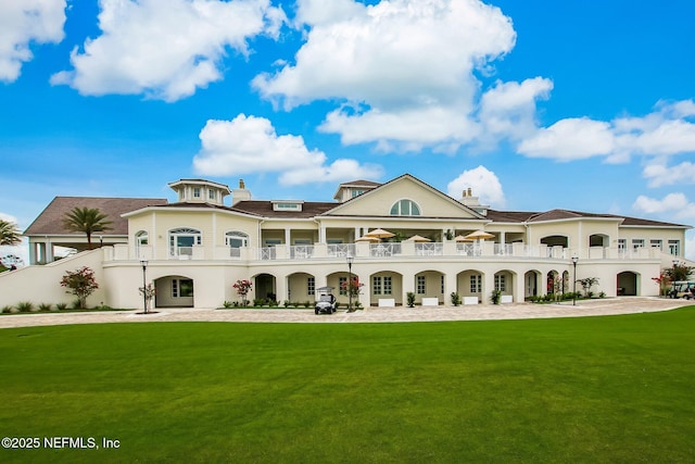 22 Walkers Ridge Dr, Ponte Vedra Beach, FL 32082 - back of property featuring a lawn, a balcony, and stucco siding