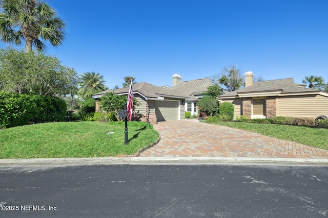 22 Walkers Ridge Dr, Ponte Vedra Beach, FL 32082 - obstructed view of property featuring a front lawn, an attached garage, driveway, and brick siding