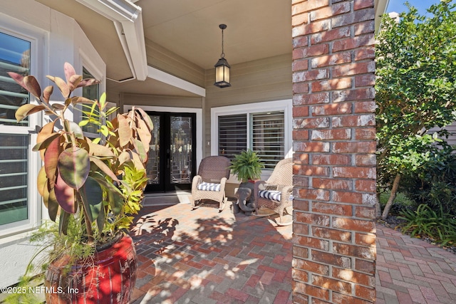 22 Walkers Ridge Dr, Ponte Vedra Beach, FL 32082 - entrance to property featuring brick siding, a patio, and french doors