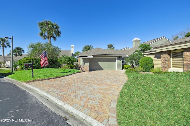22 Walkers Ridge Dr, Ponte Vedra Beach, FL 32082 - view of front of property with decorative driveway, a front lawn, brick siding, and a garage