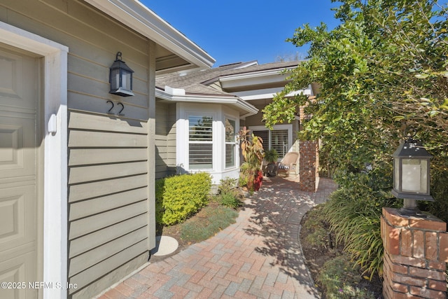22 Walkers Ridge Dr, Ponte Vedra Beach, FL 32082 - property entrance featuring roof with shingles and a patio