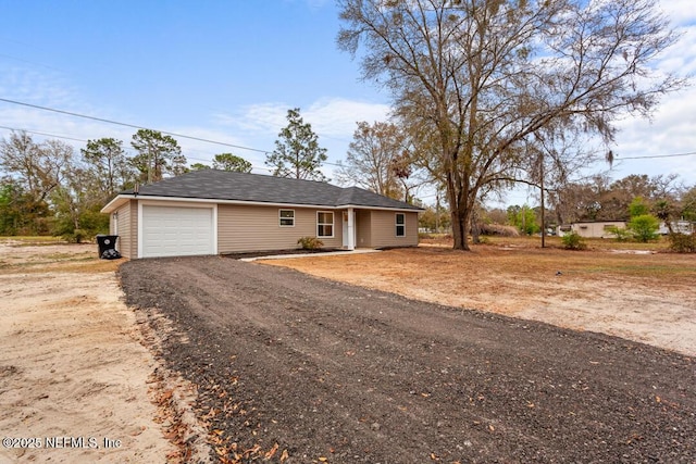 ranch-style home with driveway