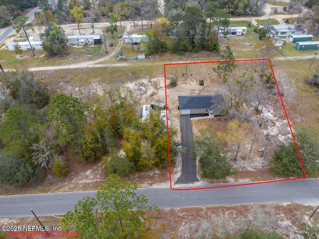 birds eye view of property with a rural view