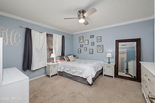 bedroom featuring ceiling fan, ornamental molding, a textured ceiling, and light colored carpet