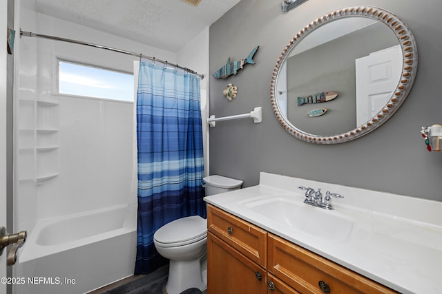 bathroom with shower / bathtub combination with curtain, vanity, toilet, and a textured ceiling