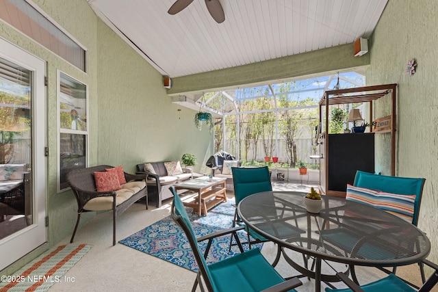 view of patio featuring a lanai, outdoor dining area, ceiling fan, and outdoor lounge area