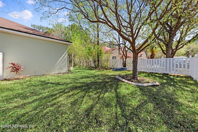 view of yard with fence