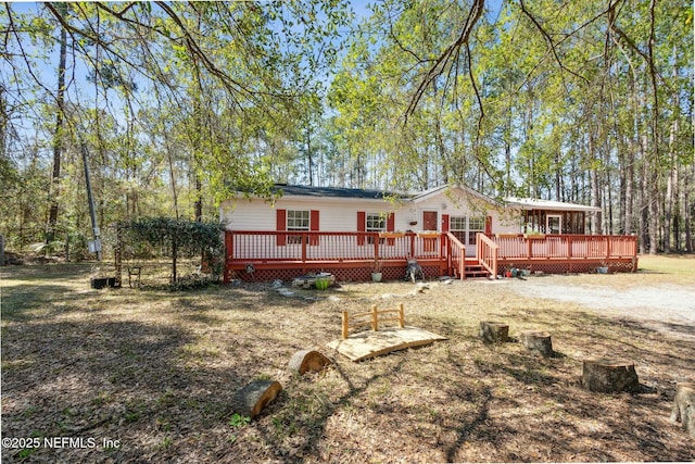 back of house featuring a wooden deck