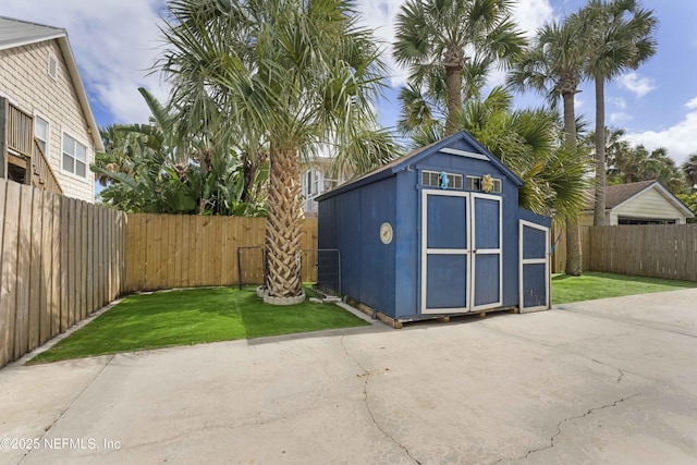 view of shed featuring a fenced backyard