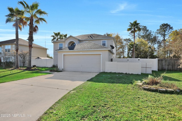 view of front of house featuring an attached garage, concrete driveway, a front yard, and fence