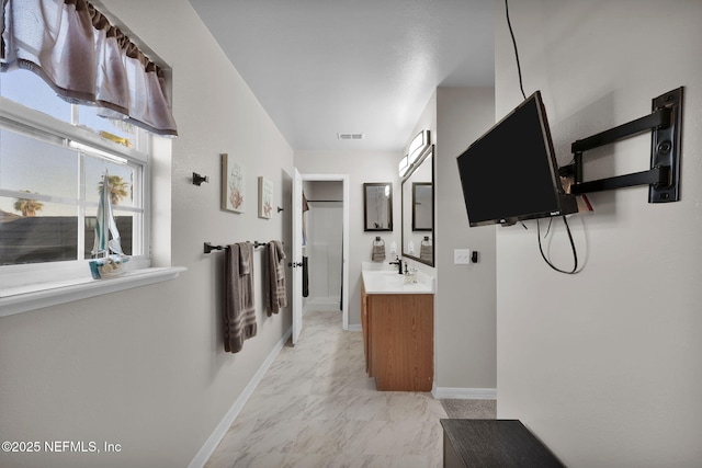 corridor featuring baseboards and marble finish floor