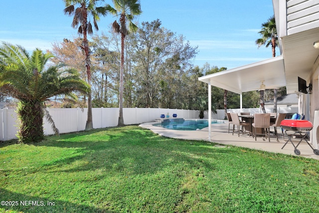 view of yard featuring a patio area, a fenced in pool, and a fenced backyard