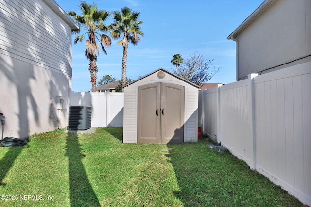 view of shed featuring central air condition unit and a fenced backyard