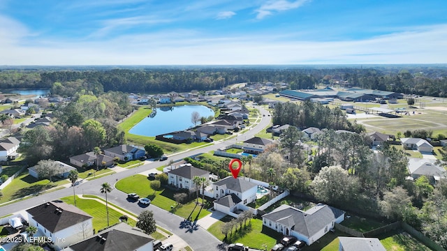 birds eye view of property featuring a residential view and a water view