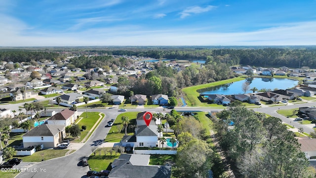 drone / aerial view with a residential view and a water view