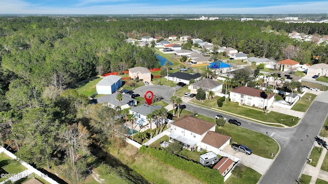 aerial view featuring a residential view and a forest view