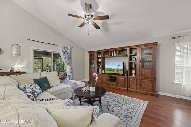 living area featuring high vaulted ceiling, a ceiling fan, baseboards, and wood finished floors