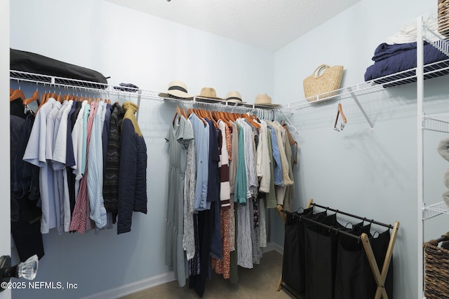 walk in closet featuring tile patterned flooring