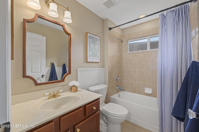 full bath with vanity, shower / bathtub combination with curtain, visible vents, tile patterned floors, and toilet