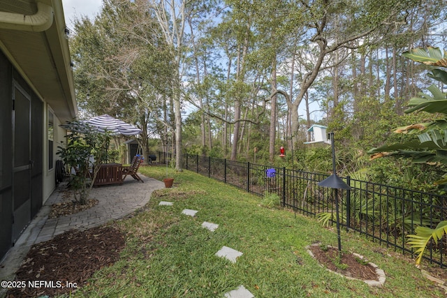 view of yard featuring a patio and a fenced backyard