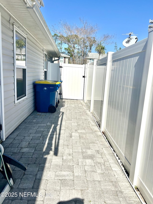 view of patio / terrace with fence and a gate